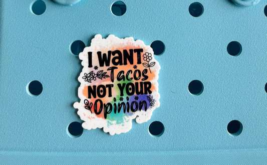 A light blue tote bag with a sticker on it.