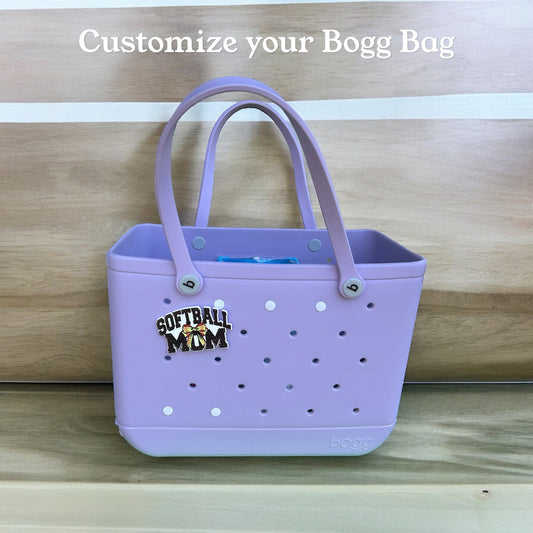 a purple tote bag sitting on top of a wooden shelf