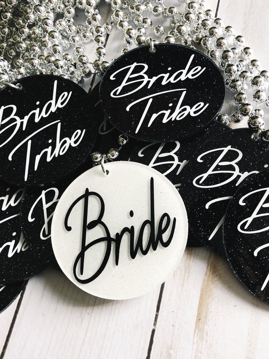 a bunch of black and white buttons that say bride tribe