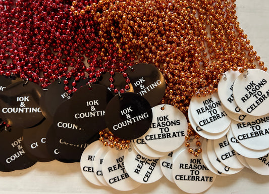 a table topped with lots of black and white tags
