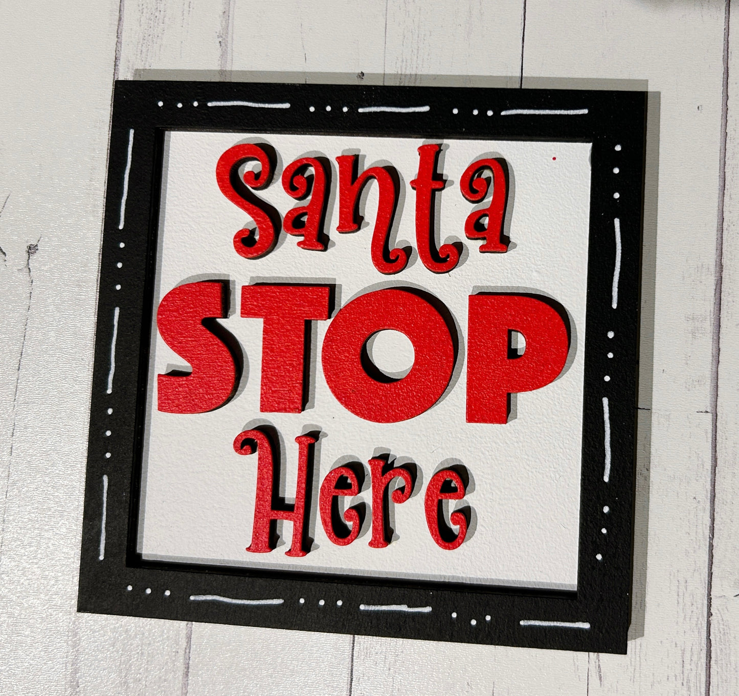 a picture of a sign that says santa stop here