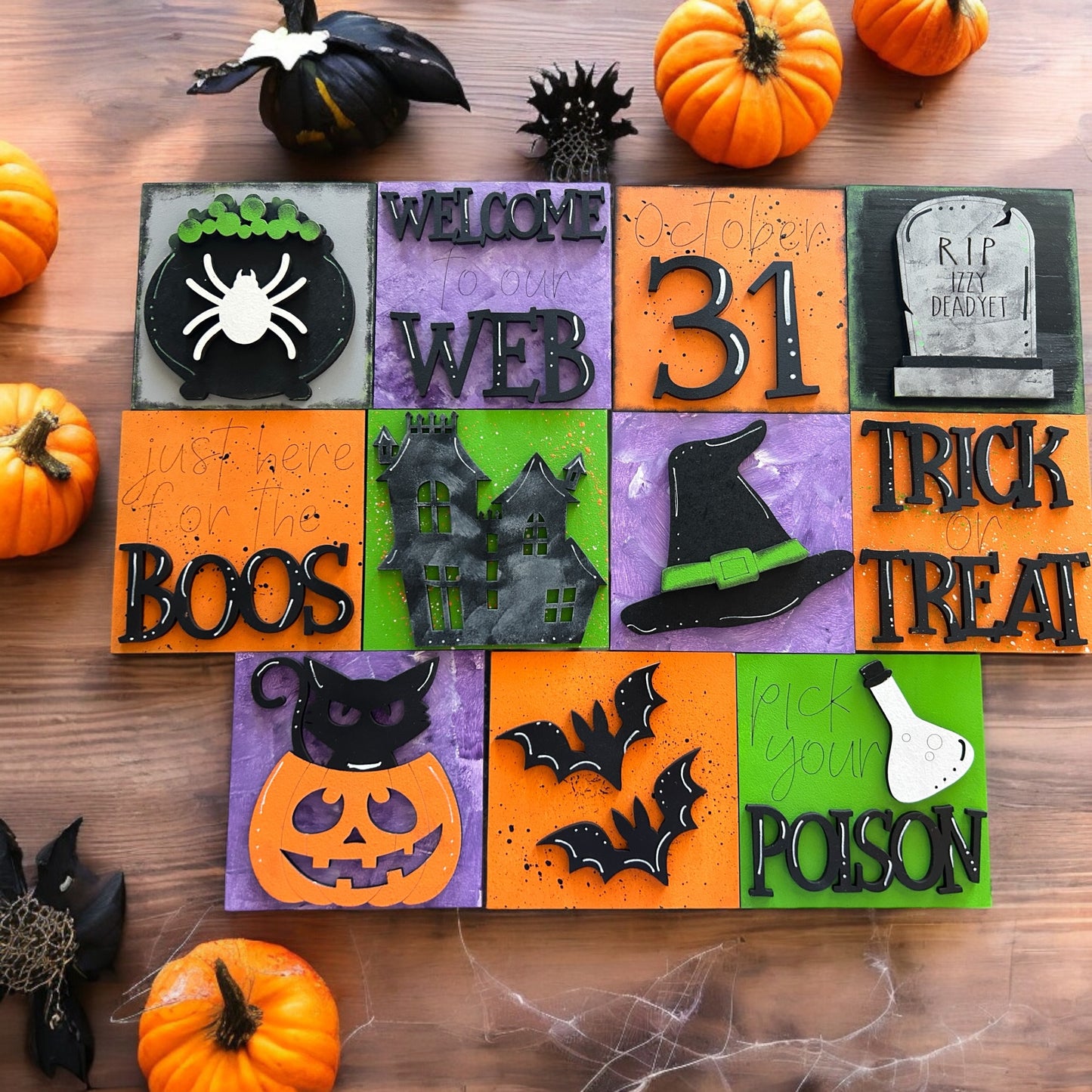 a wooden table topped with lots of halloween decorations