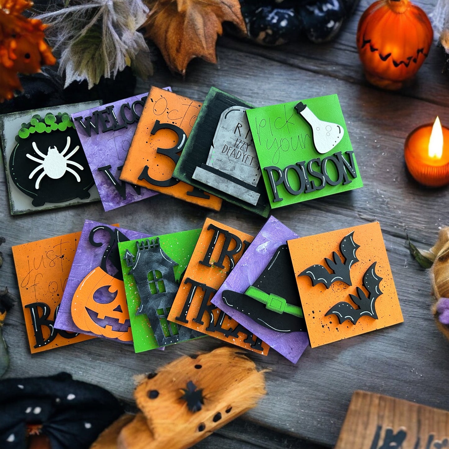 a pile of halloween cards sitting on top of a wooden table