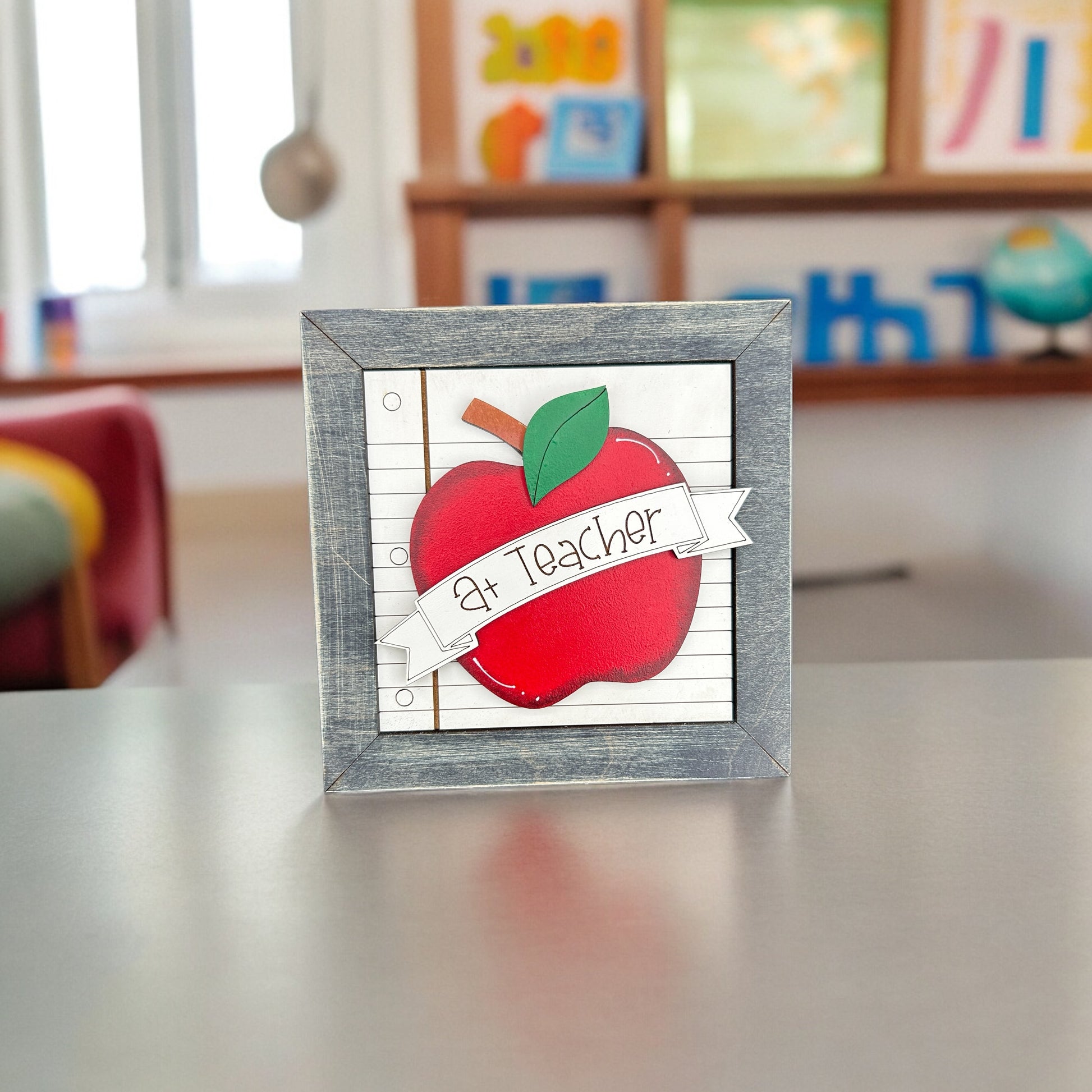 a picture of an apple with a ribbon on it