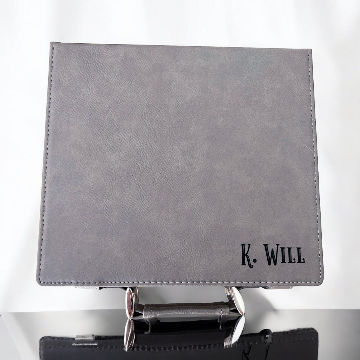 a black wallet with a k will logo on it