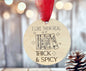 A wooden ornament with a red ribbon, featuring a humorous text and illustrations related to books.