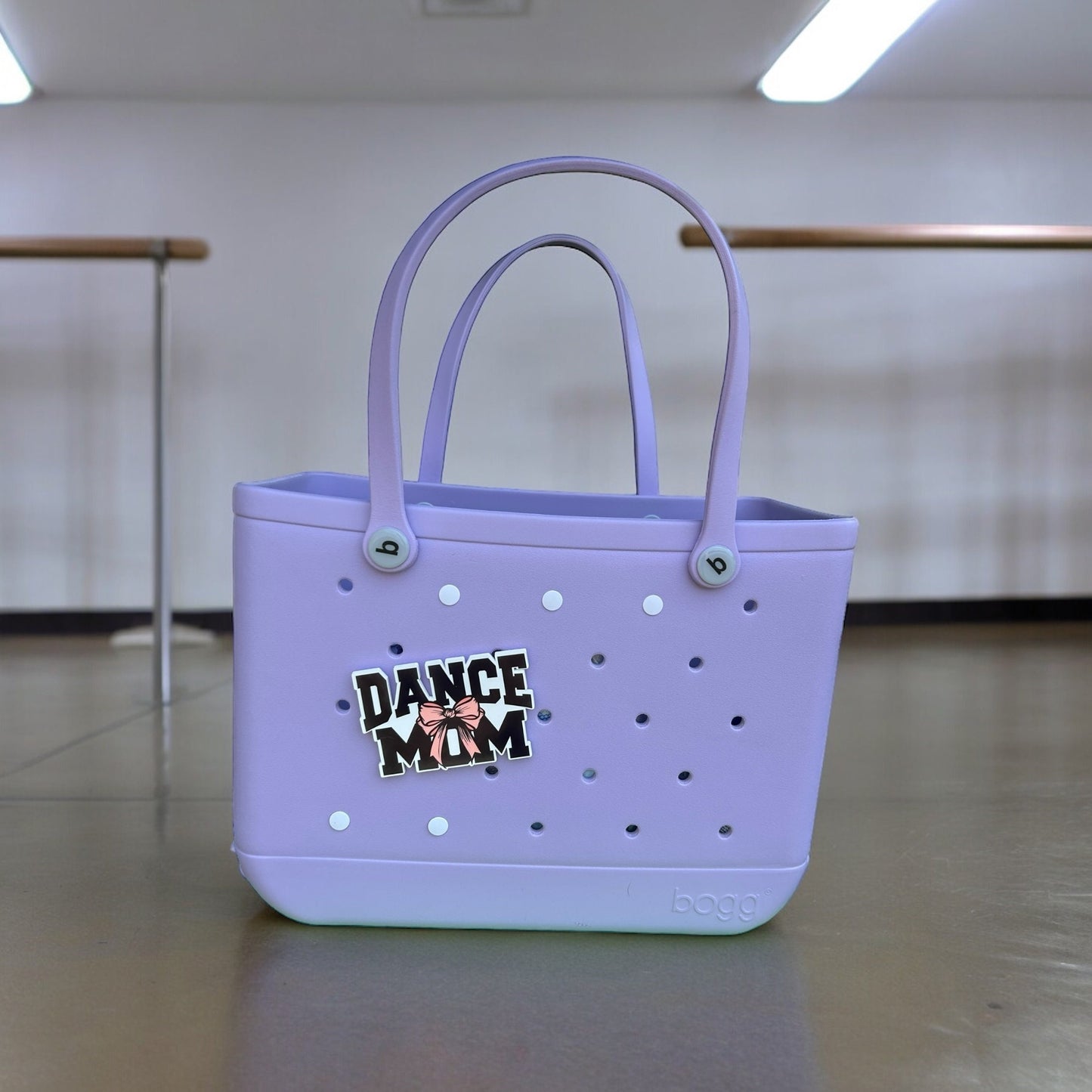 a purple bag with a sticker on it