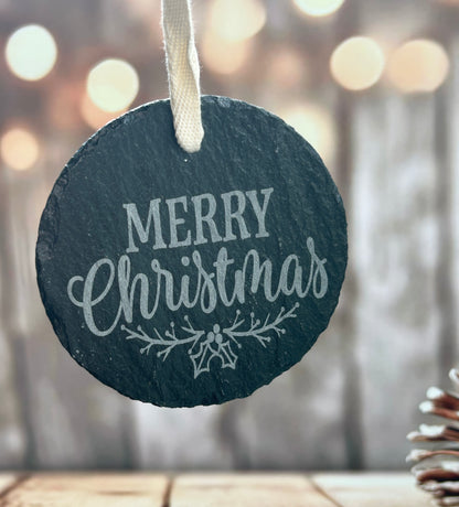 a black slate ornament with a merry christmas message