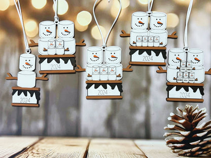 a wooden table topped with christmas decorations and a pine cone