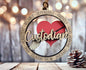 A wooden ornament with the word "Custodian" written on it, featuring a heart and a broom, is hanging on a wooden surface.