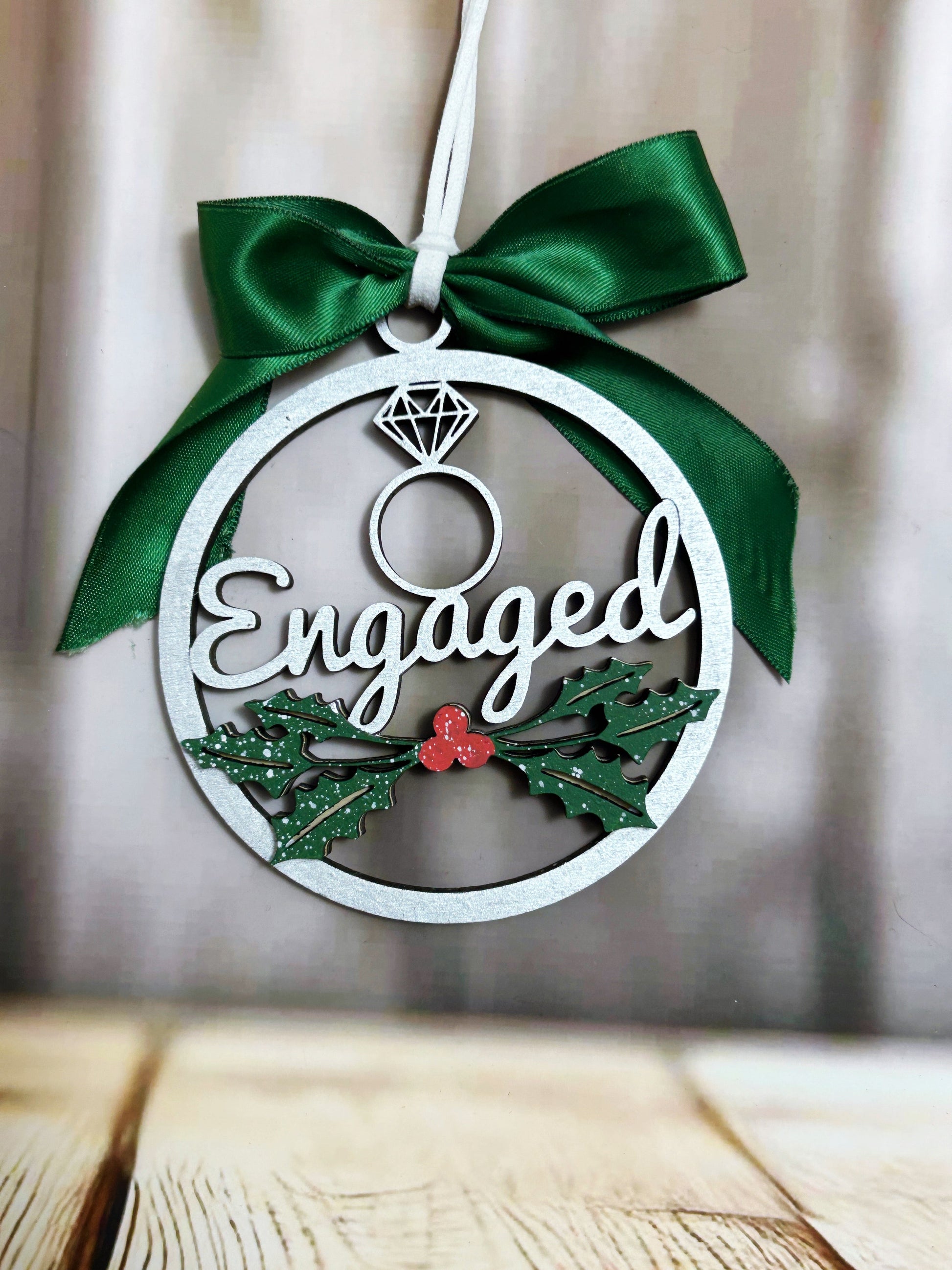 a christmas ornament hanging from a wooden table