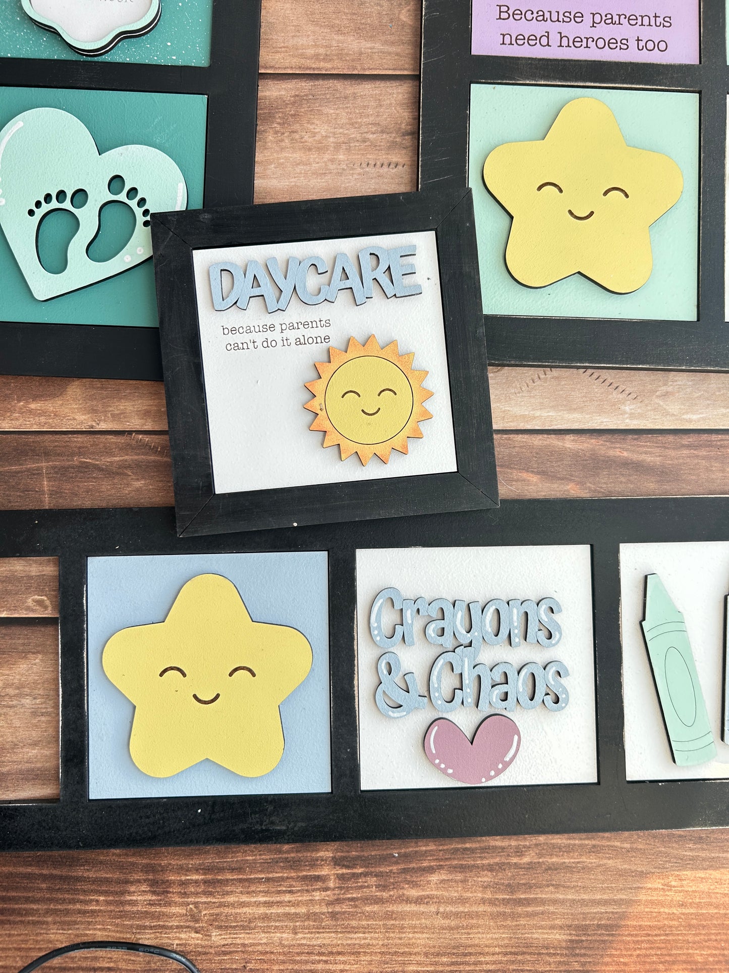 Collection of paper cutouts with various shapes and text on a wooden surface