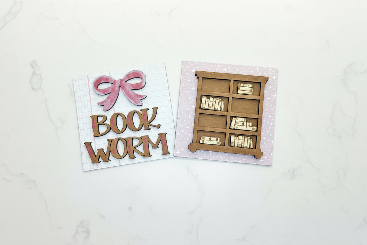 Wooden book mold and decorative letters on a wooden surface