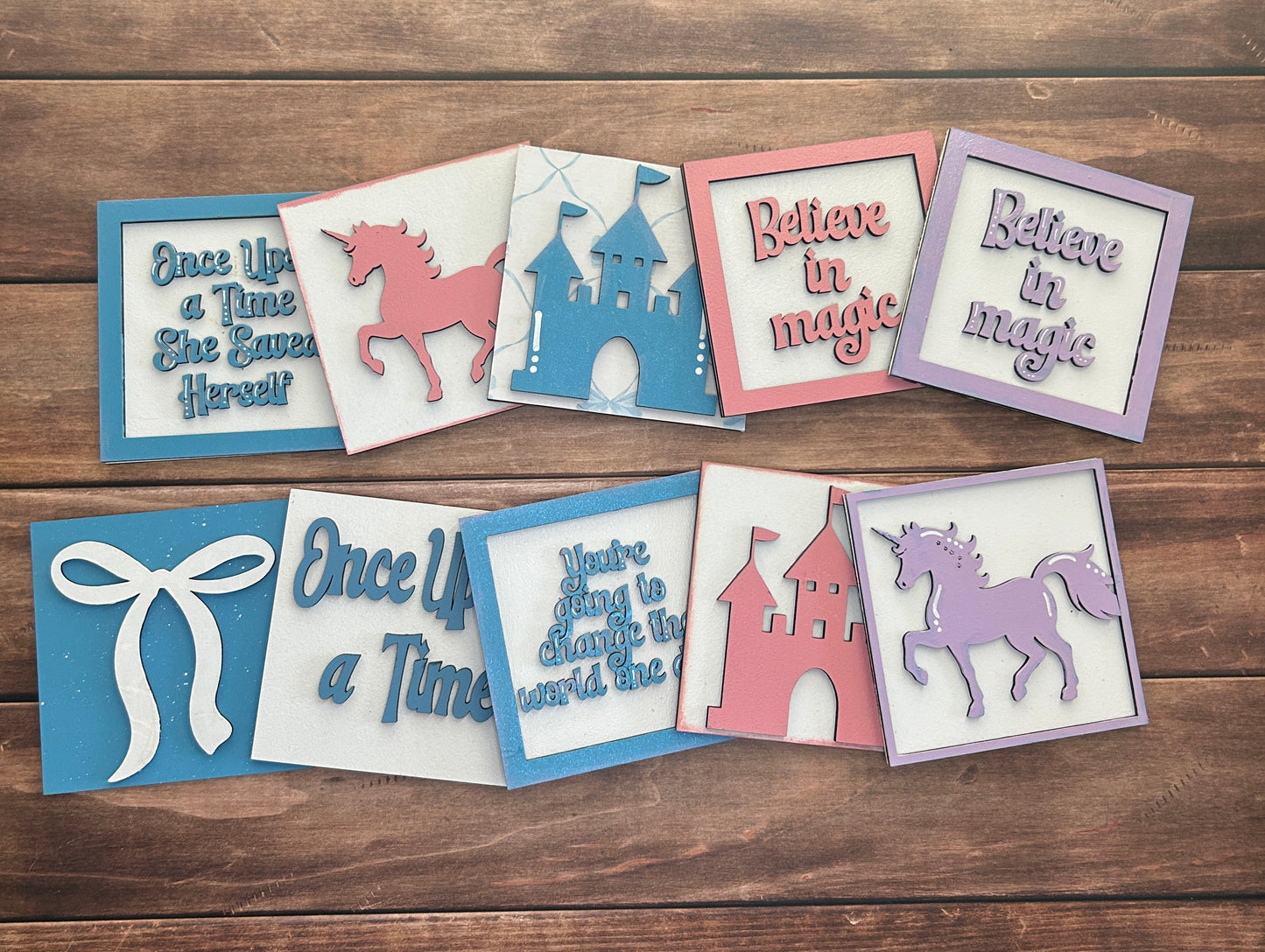 Decorative cards with text and animal illustrations on a wooden surface