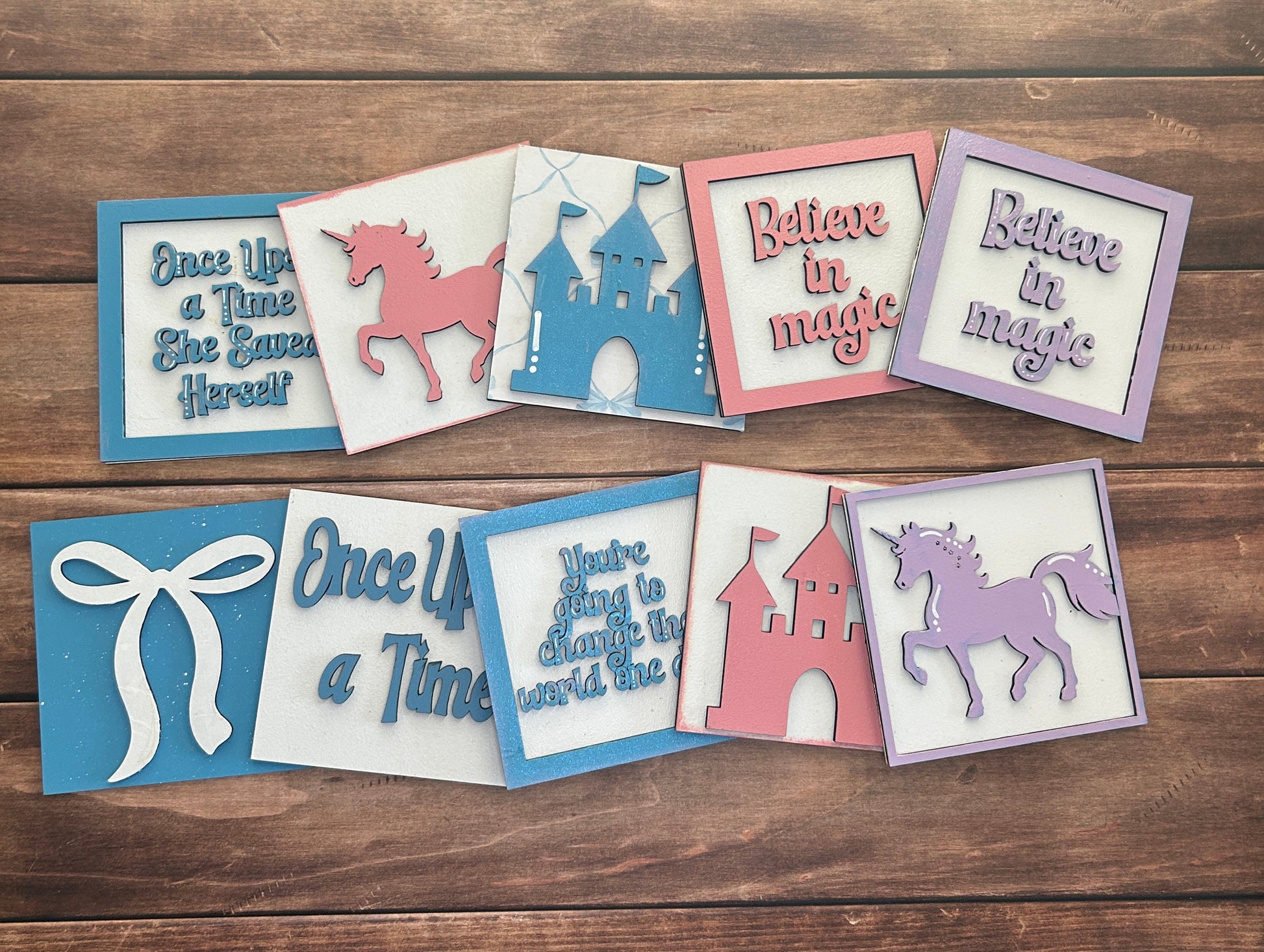 Decorative cards with text and animal illustrations on a wooden surface