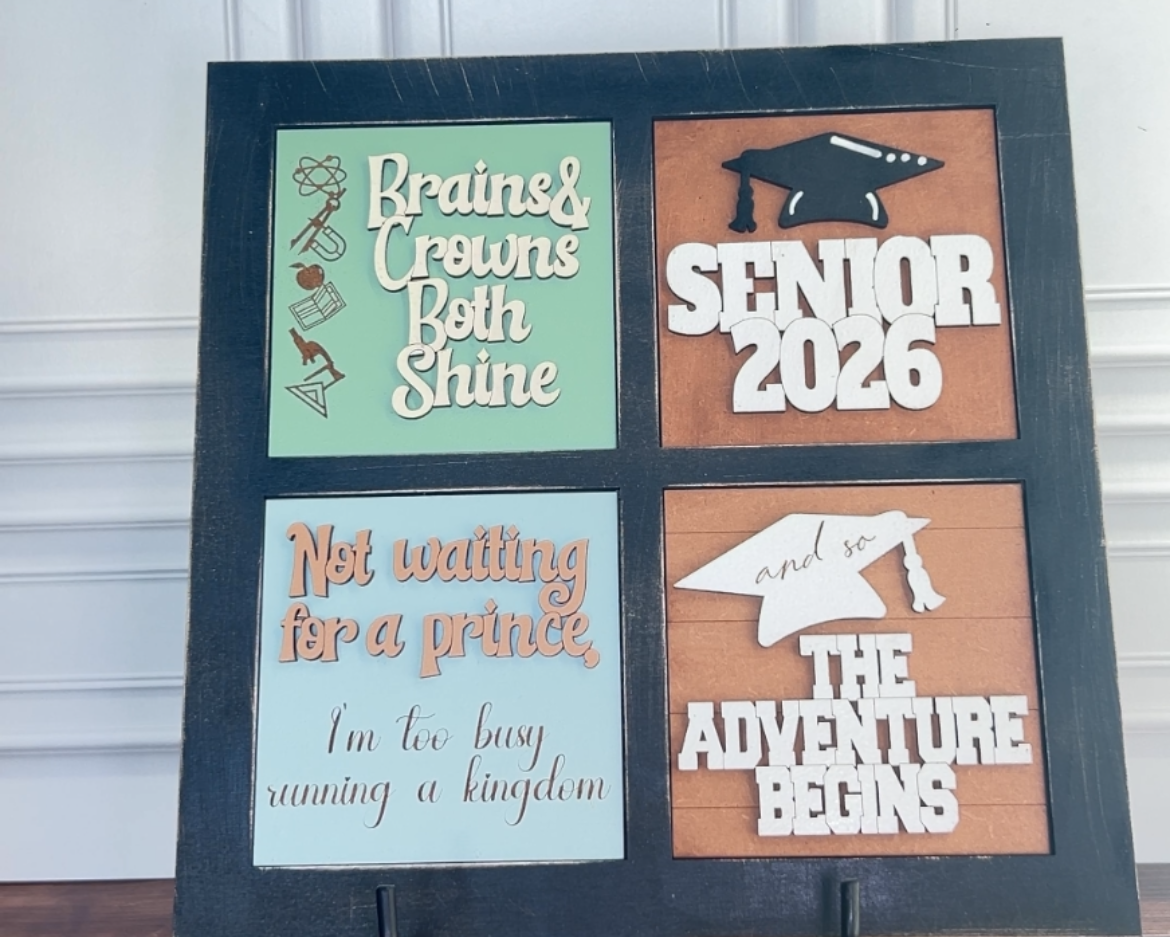 Seniors 2026 themed decorative board with text and graphics on a stand.