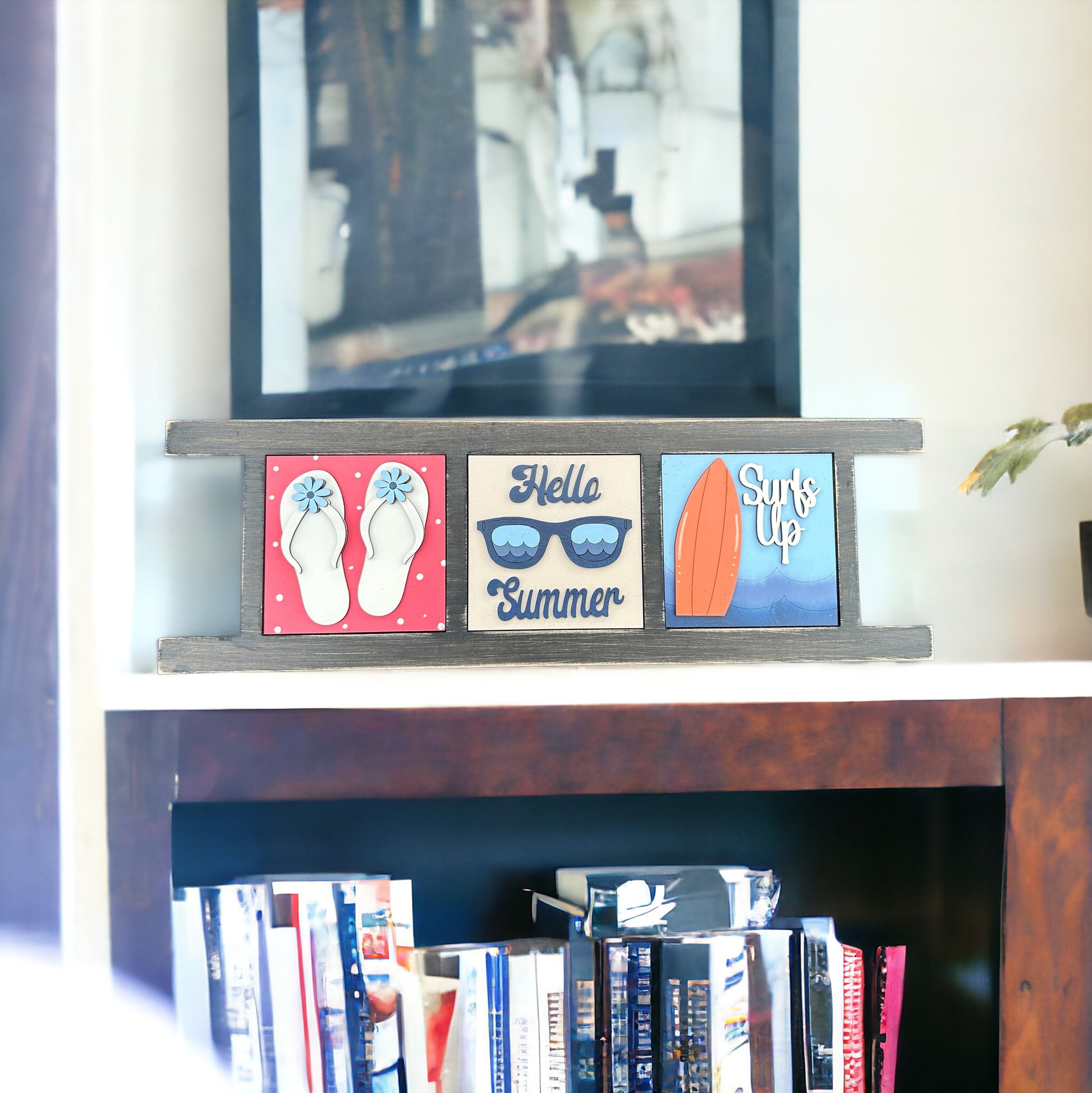 a book shelf with books and a television on top of it