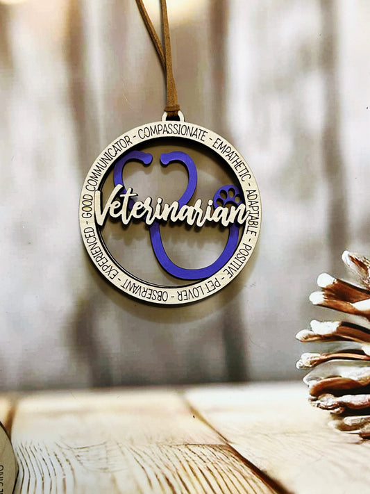 A wooden pendant with the word "Veterinarian" written on it, hanging on a string.