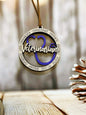 A wooden pendant with the word "Veterinarian" written on it, hanging on a string.