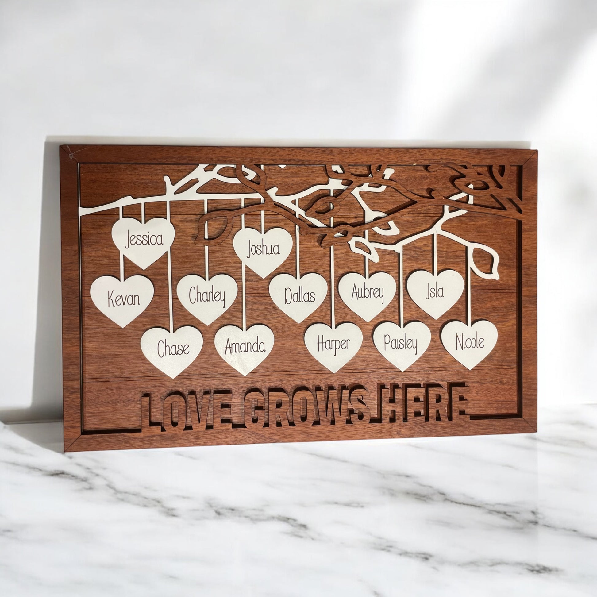 a wooden card with hearts hanging from it