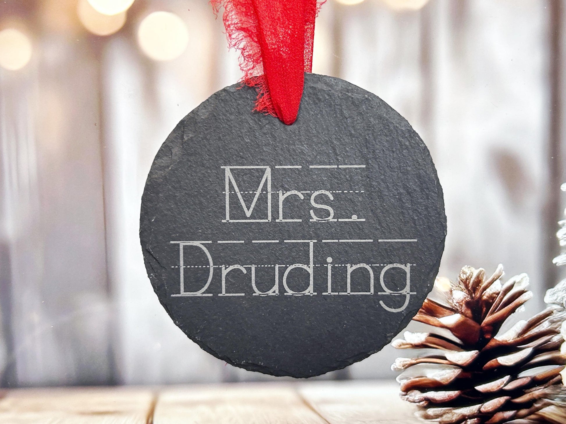 a slate ornament with the words mrs druiding written on it