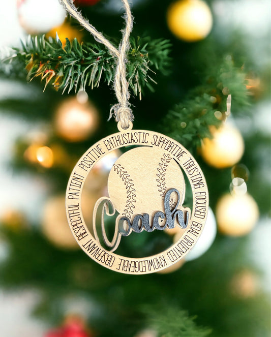 a baseball ornament hanging from a christmas tree